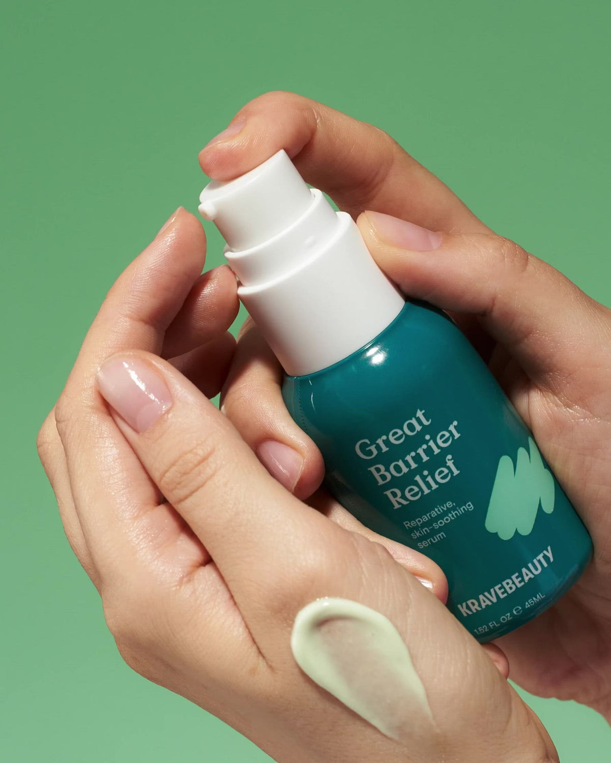 Hand pumping Great Barrier Relief serum onto finger #size_1.52 oz / 45 ml