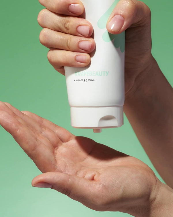 Hand dispensing Great Body Relief Lotion onto palm of hand